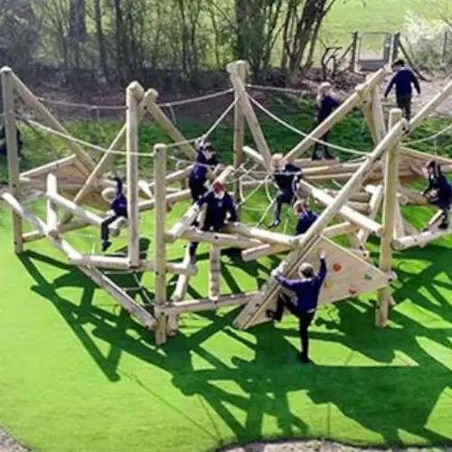 primary school children climbing on playframe