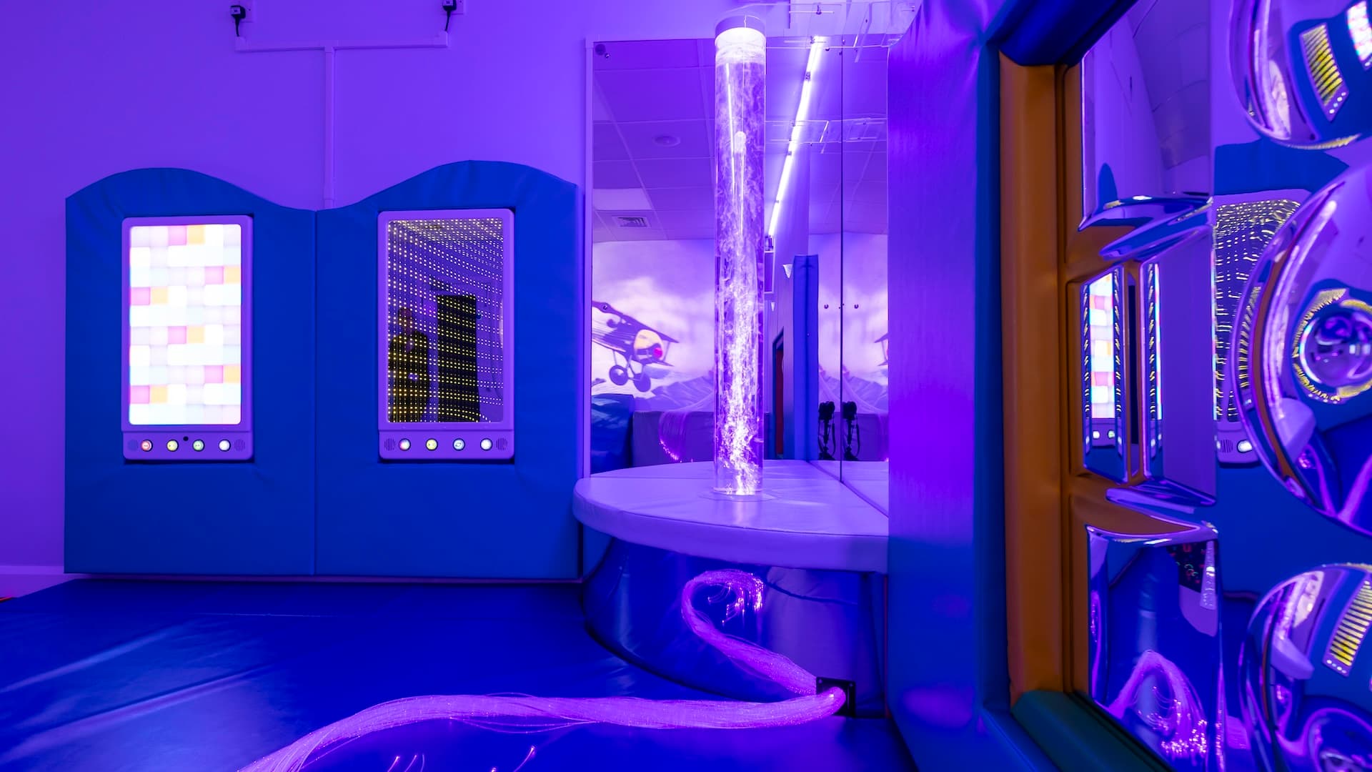 Image of a sensory room with a variety of sensory equipment