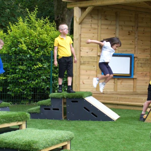 school child jumping off of Get Set, Go! Block