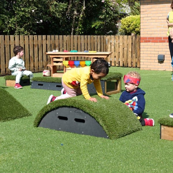nursery child crawling over Hill Block in Get Set, Go! Blocks range