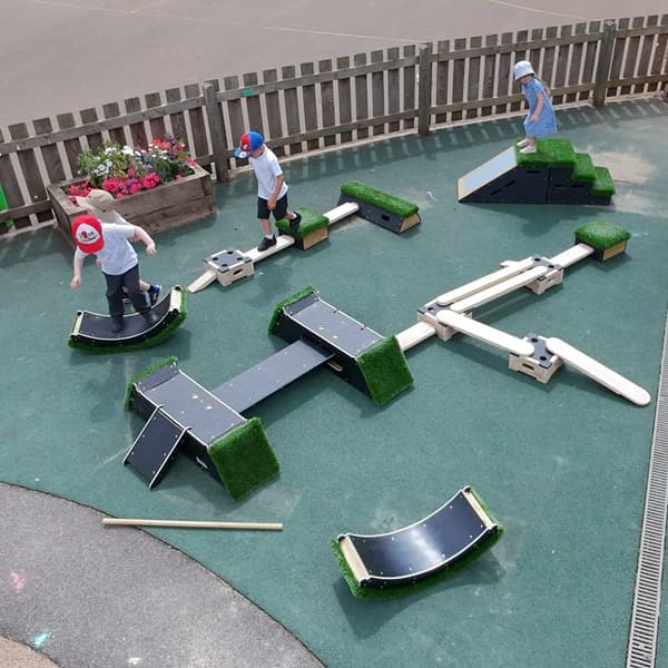 children playing on a Pentagon Play Sports Premium package of Get Set, Go! Blocks, Play Builder and The Rockies products in an outdoor play environment