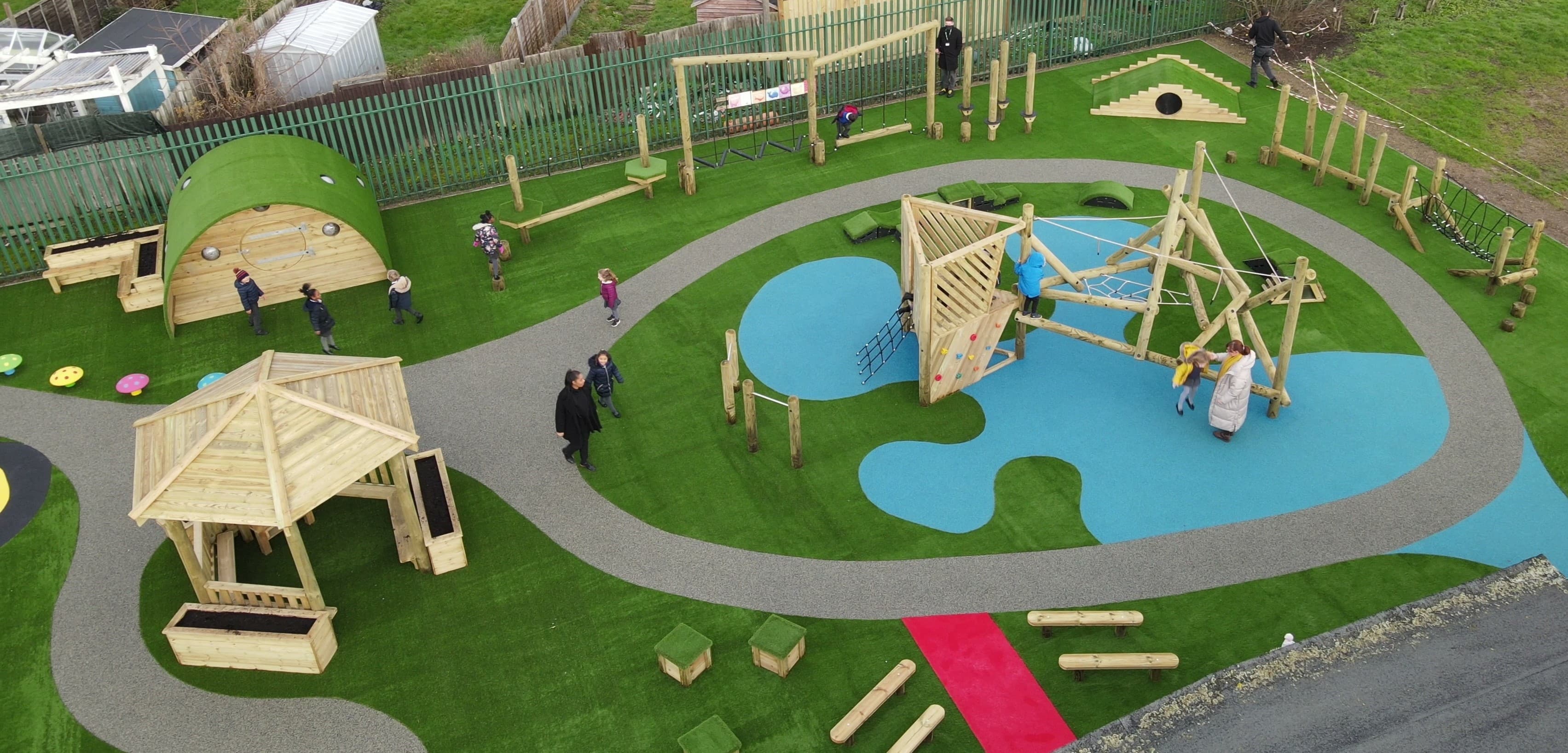A Pentagon Play bespoke School Playground Scheme with children playing on the playground