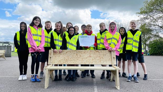 Students stood around their Leavers Bench