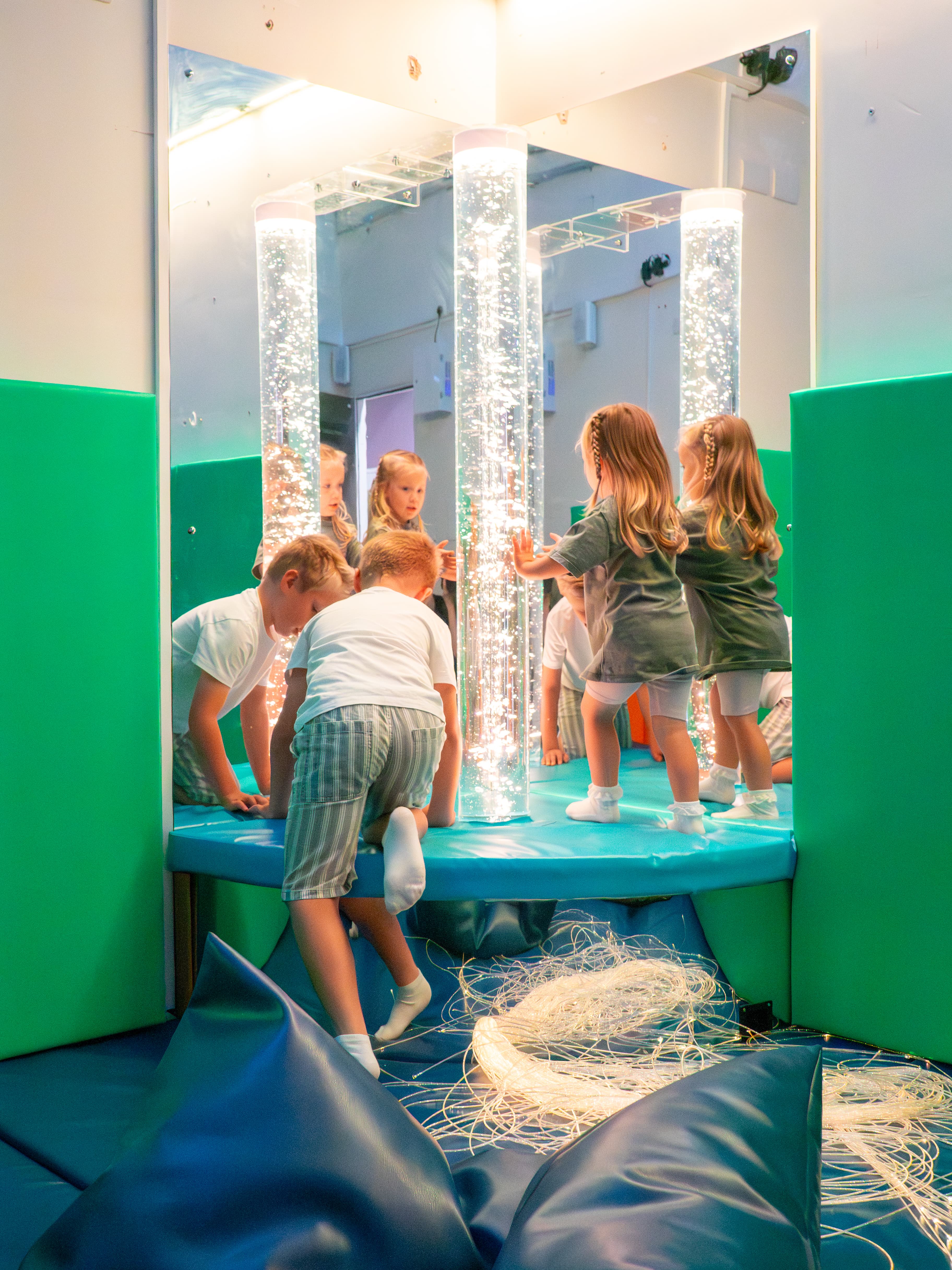 Image of a sensory room with a variety of sensory equipment