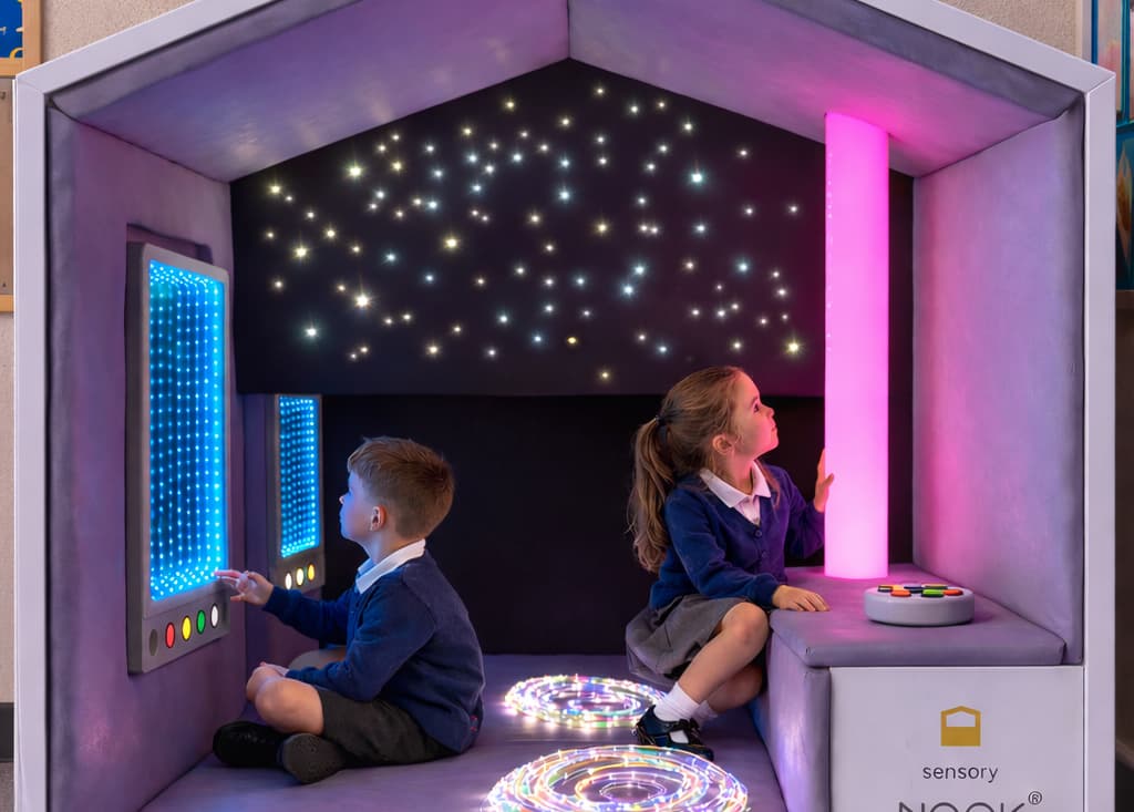 two children playing inside a Sensory Nook