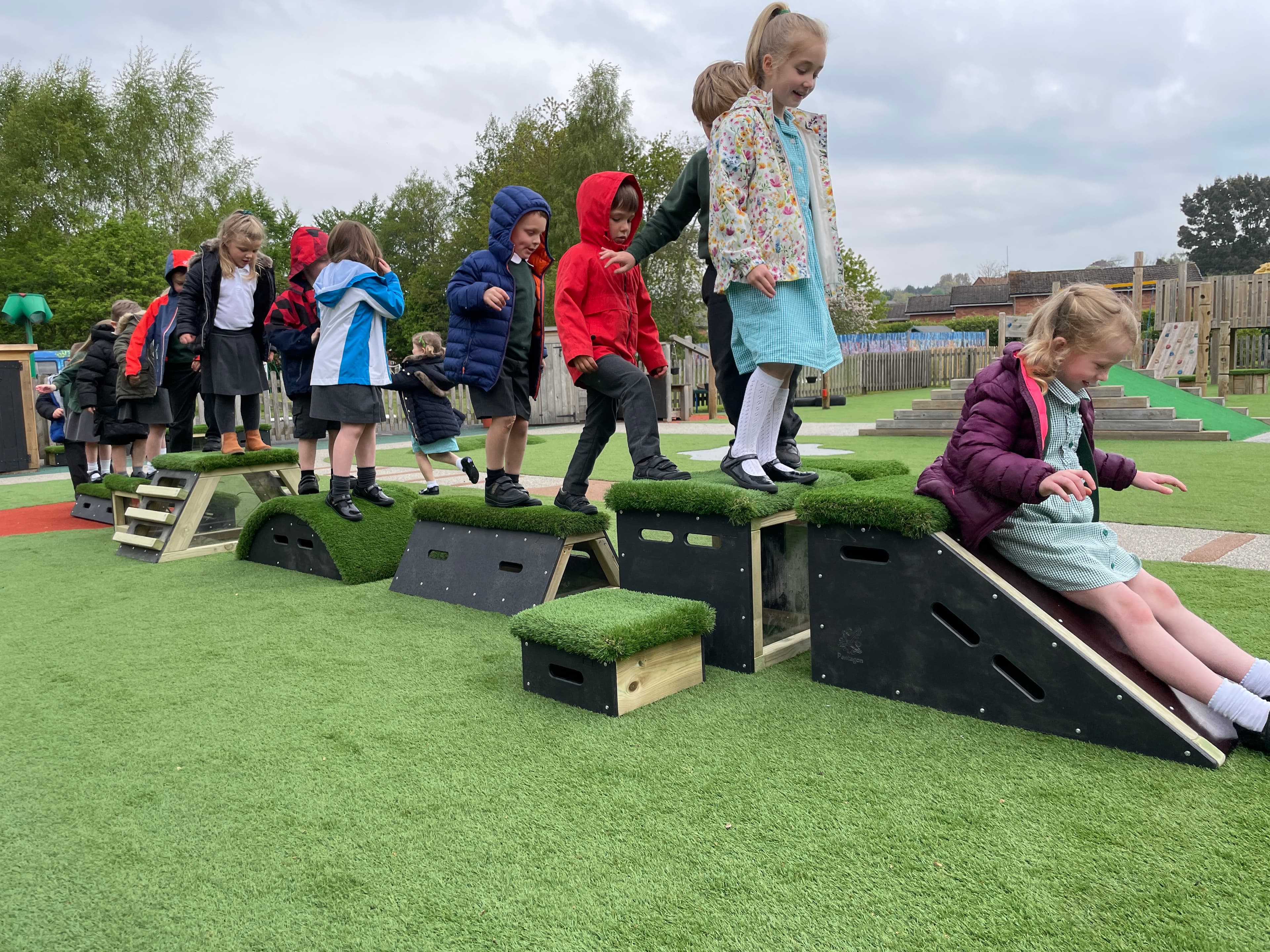 Group of children climbing and jumping on the Get Set, Go Blocks