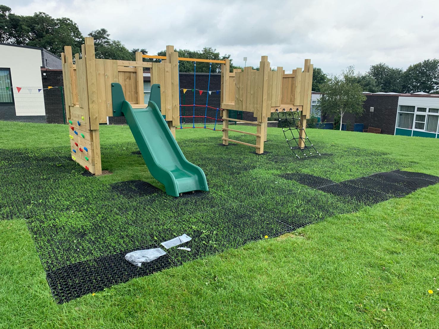 Safermats allow the grass to grow through, creating a natural-looking safer place to play