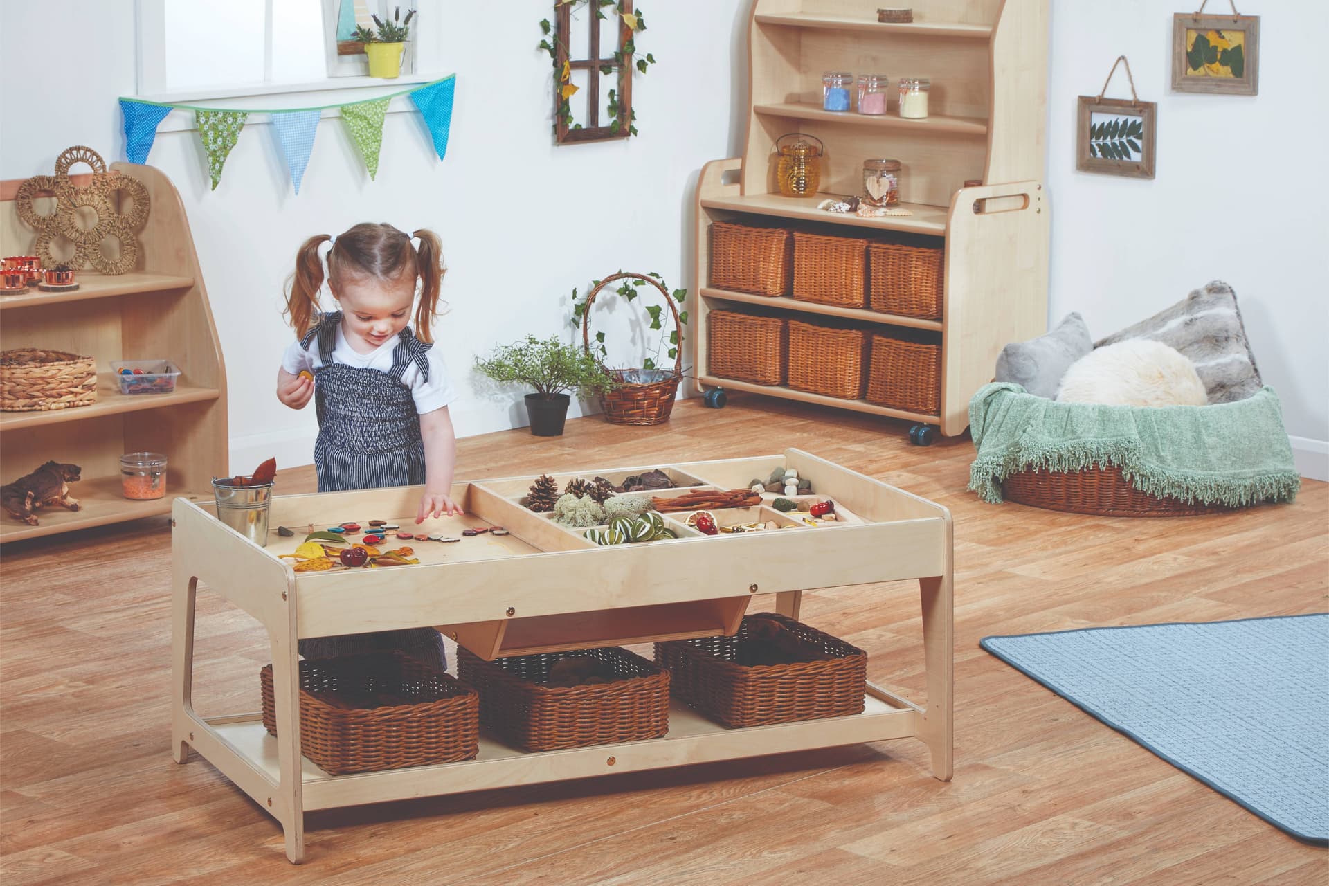 With 7 compartments, there is plenty of space for of loose parts in the Investigative Play Table