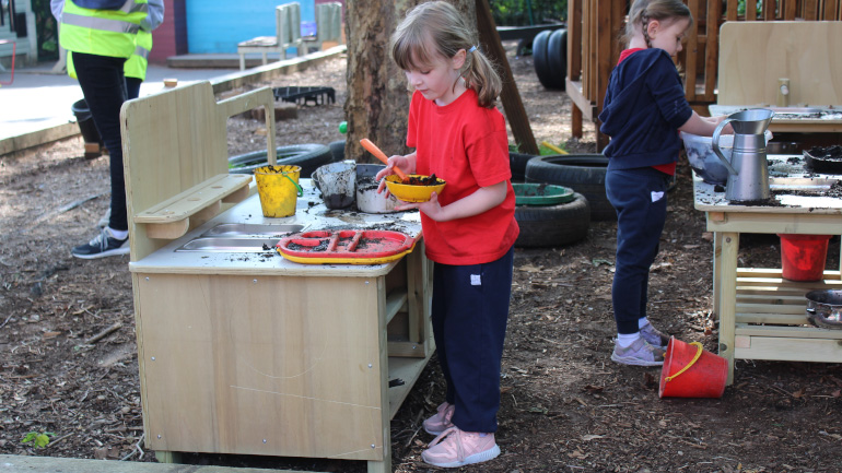 Students playing with mud sink
