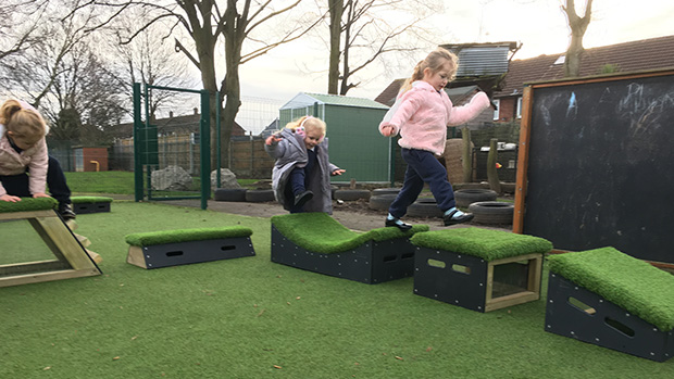 primary school children walking along Get Set Go! Blocks