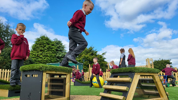 school child jumping between Get Set Go! Blocks