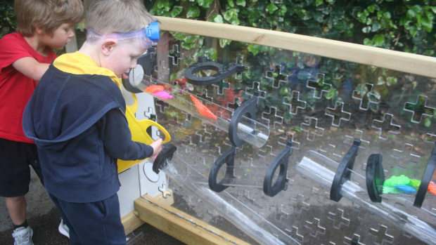 children playing with water wall