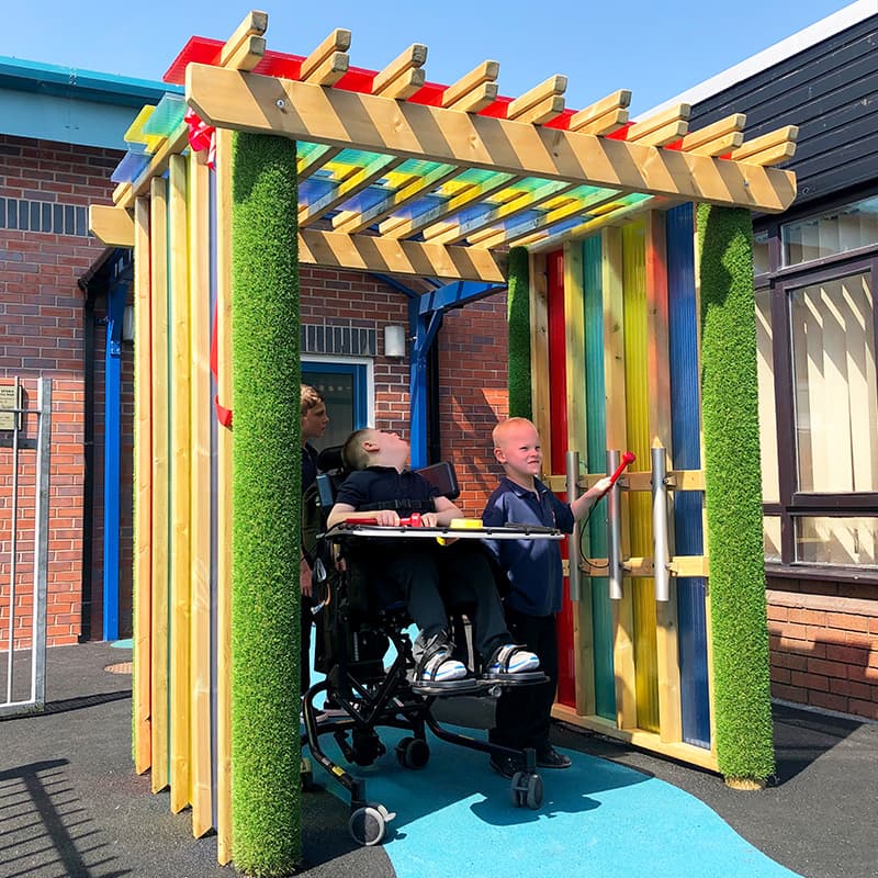 SEN children enjoying play time in the Pentagon Play Sensory Arbour outside in the playground