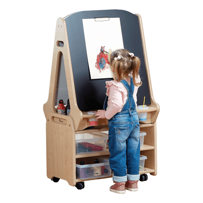 two school children drawing on art easel