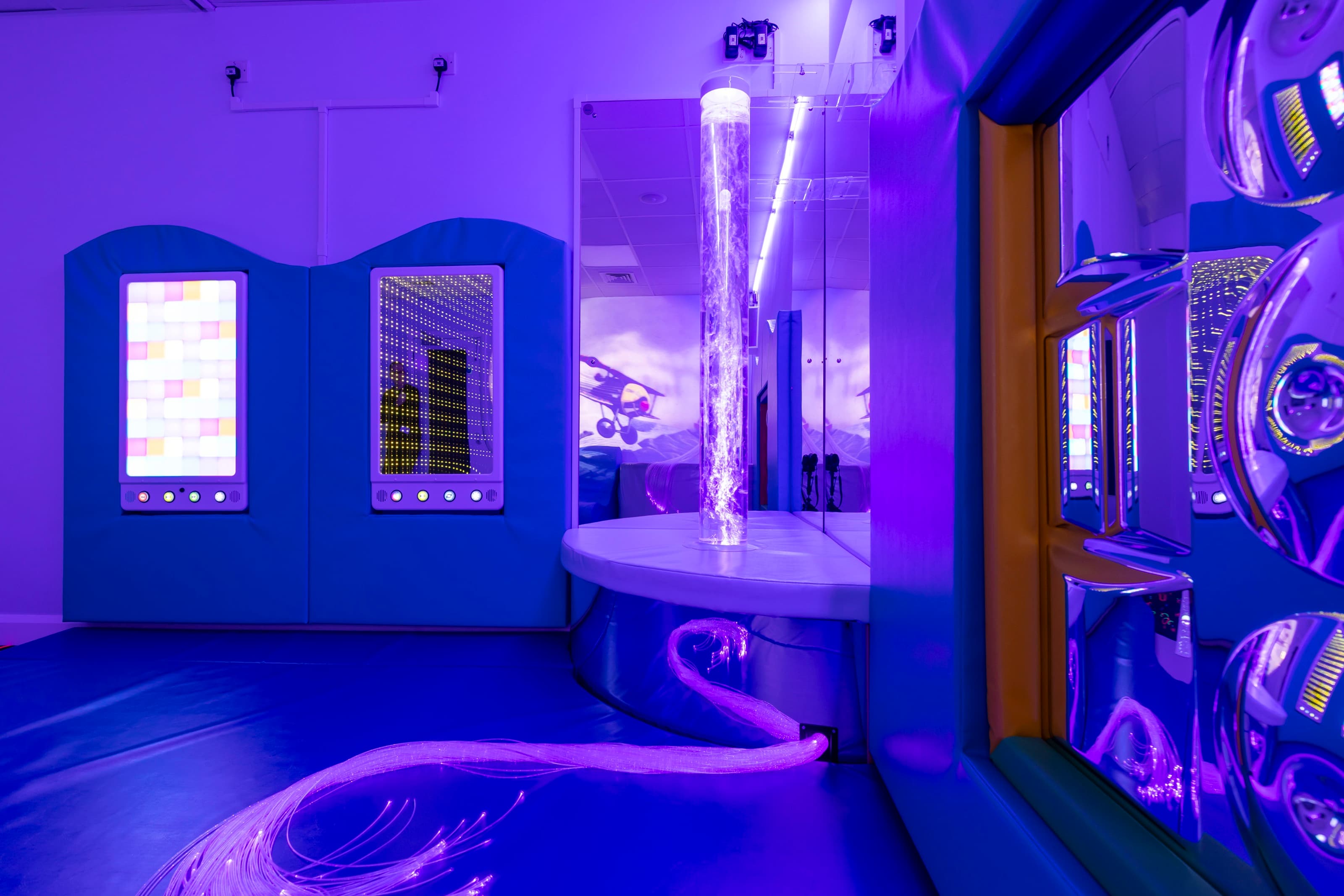 Image of a sensory room with a variety of sensory equipment